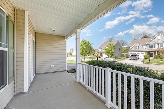 balcony with a residential view and a porch