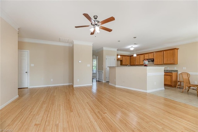 unfurnished living room with light wood-style flooring, crown molding, a ceiling fan, and visible vents