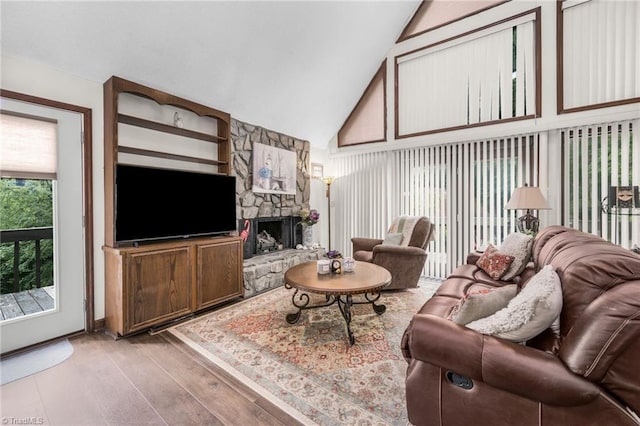 1920 Chateau Rdg, Winston-Salem, NC 27103 - living area featuring wood finished floors, a stone fireplace, and high vaulted ceiling