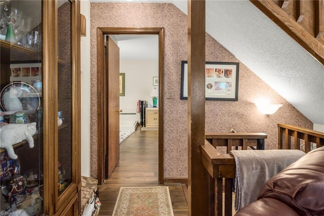 1920 Chateau Rdg, Winston-Salem, NC 27103 - hall featuring wood finished floors, lofted ceiling, wallpapered walls, and a textured ceiling