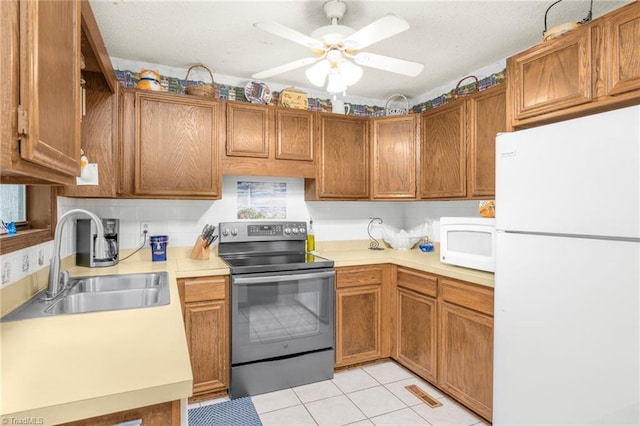 1920 Chateau Rdg, Winston-Salem, NC 27103 - kitchen with white appliances, a sink, light countertops, a ceiling fan, and light tile patterned floors