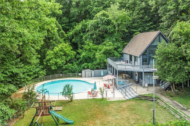 1920 Chateau Rdg, Winston-Salem, NC 27103 - view of pool with a patio, a playground, a forest view, a deck, and stairs
