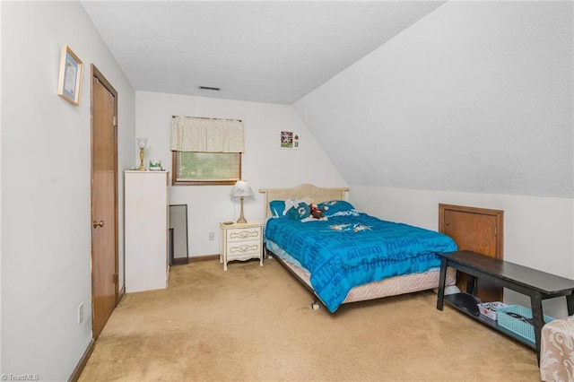 1920 Chateau Rdg, Winston-Salem, NC 27103 - carpeted bedroom with a textured ceiling and vaulted ceiling