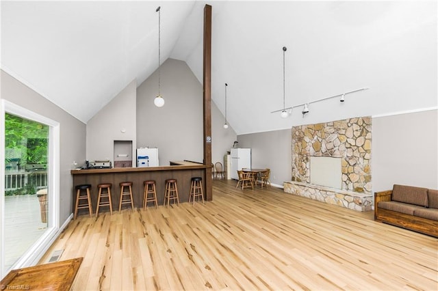 1920 Chateau Rdg, Winston-Salem, NC 27103 - living area featuring wood finished floors, a fireplace, and high vaulted ceiling