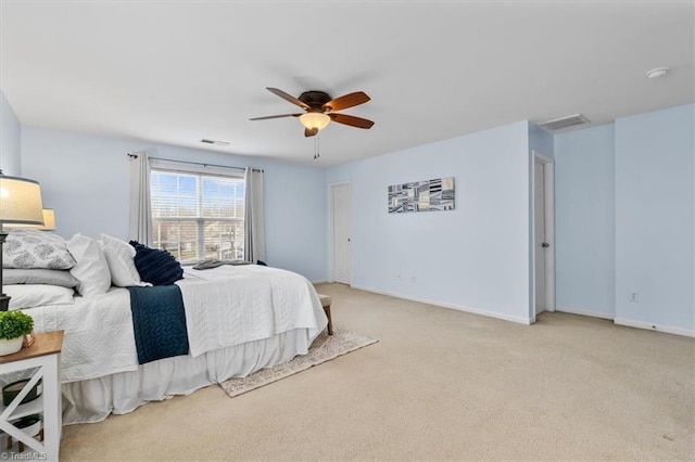 bedroom featuring light carpet, visible vents, baseboards, and a ceiling fan