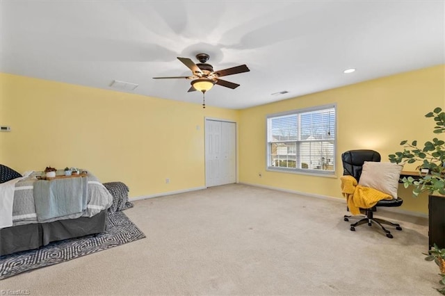 bedroom with ceiling fan, a closet, carpet, and baseboards