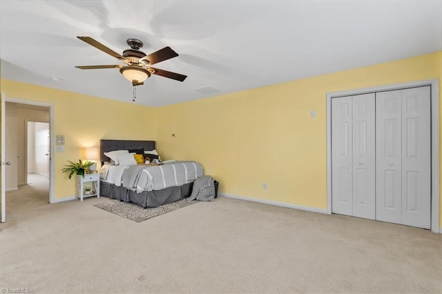 bedroom featuring baseboards, ceiling fan, and light colored carpet