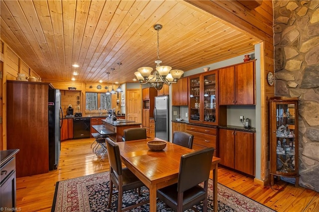 dining space with a notable chandelier, wooden ceiling, and light wood-type flooring