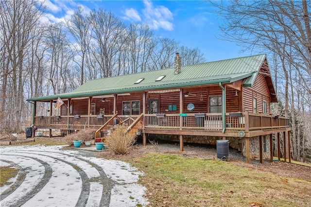 back of property featuring ceiling fan