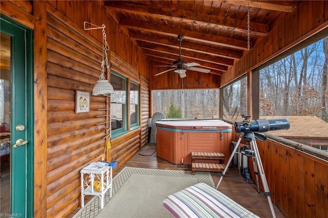 sunroom / solarium featuring wood ceiling, a hot tub, and lofted ceiling with beams