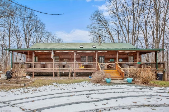 log-style house with a porch