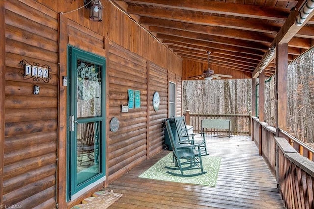 deck with ceiling fan and a porch