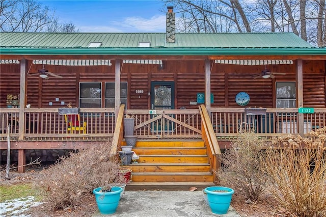 view of side of property with ceiling fan