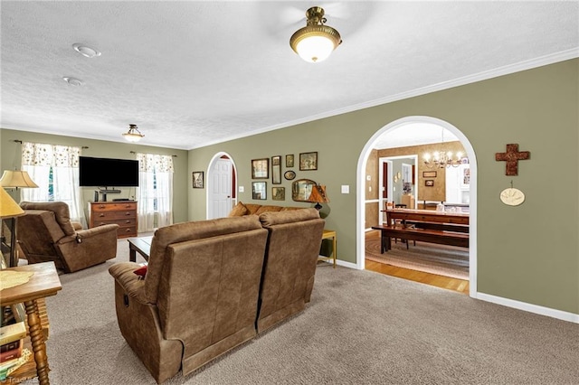 4717 Deaton Rd, Trinity, NC 27370 - living room featuring arched walkways, carpet flooring, crown molding, a chandelier, and a textured ceiling