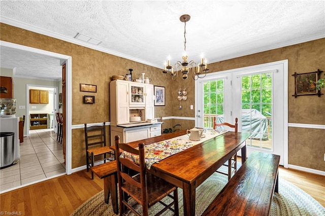 4717 Deaton Rd, Trinity, NC 27370 - dining area with a textured ceiling, light wood-style floors, a chandelier, and ornamental molding