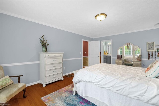 4717 Deaton Rd, Trinity, NC 27370 - bedroom with wood finished floors, crown molding, and ensuite bathroom