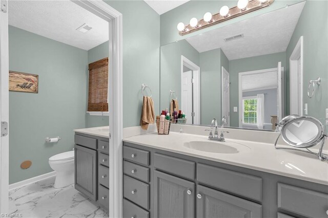 4717 Deaton Rd, Trinity, NC 27370 - bathroom featuring vanity, a textured ceiling, and marble look tiles