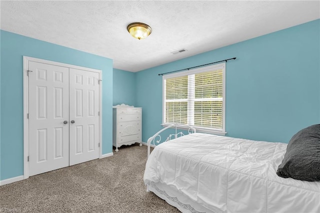 4717 Deaton Rd, Trinity, NC 27370 - bedroom featuring a closet, carpet, and a textured ceiling