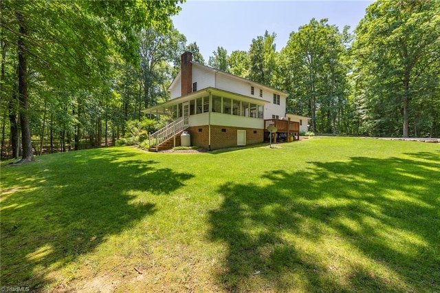 4717 Deaton Rd, Trinity, NC 27370 - back of house with a sunroom, stairway, a chimney, and a yard