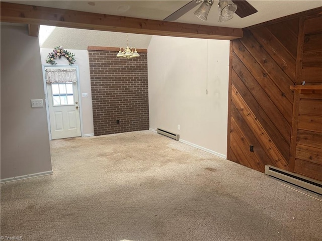 empty room with carpet floors, beamed ceiling, ceiling fan, wooden walls, and a baseboard radiator