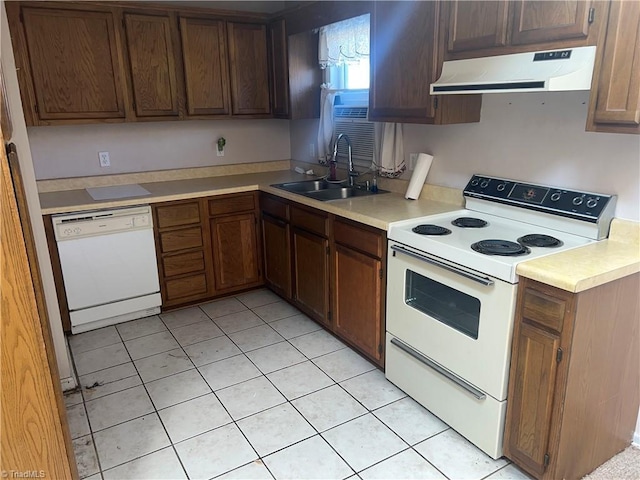 kitchen featuring white appliances, light tile patterned floors, ventilation hood, and sink