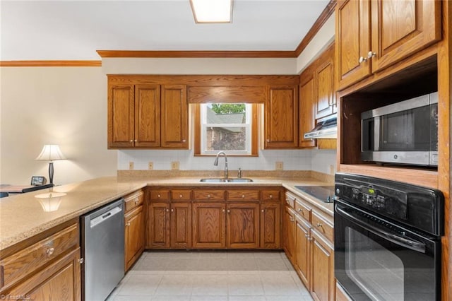 kitchen featuring black appliances, a sink, brown cabinetry, and crown molding