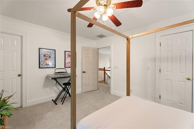 bedroom featuring light carpet, ornamental molding, baseboards, and a ceiling fan