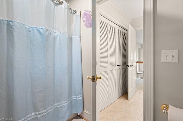 full bath with tile patterned floors and ornamental molding