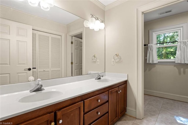 full bathroom featuring tile patterned floors, double vanity, baseboards, and crown molding