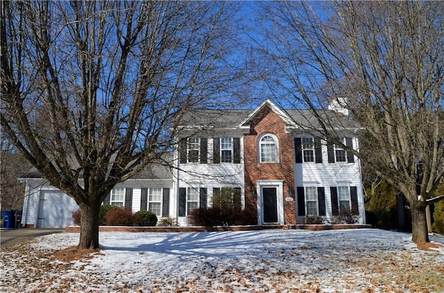 colonial-style house featuring a garage