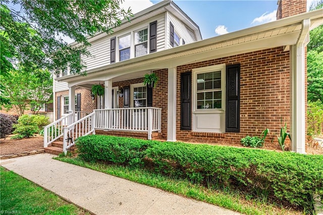 2014 Medhurst Dr, Greensboro, NC 27410 - traditional-style house with brick siding and a porch