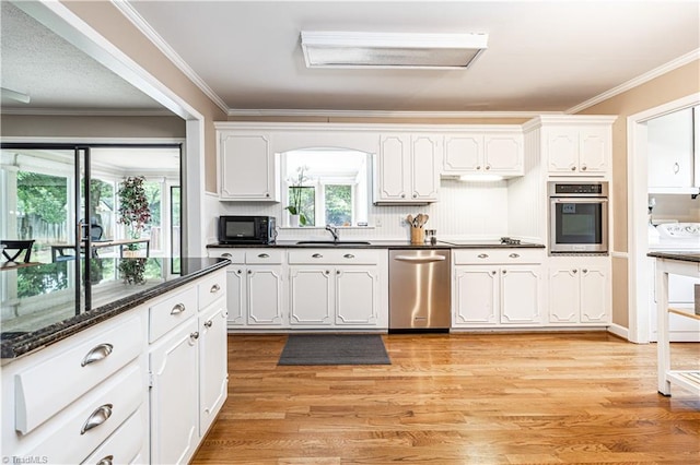 2014 Medhurst Dr, Greensboro, NC 27410 - kitchen with stainless steel appliances, white cabinets, ornamental molding, light wood finished floors, and a sink