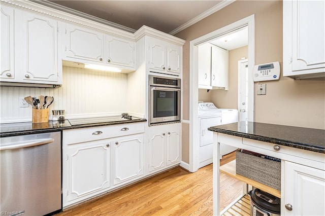 2014 Medhurst Dr, Greensboro, NC 27410 - kitchen with appliances with stainless steel finishes, light wood-style flooring, white cabinets, ornamental molding, and independent washer and dryer