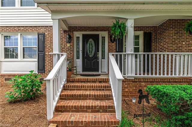 2014 Medhurst Dr, Greensboro, NC 27410 - property entrance featuring brick siding and covered porch