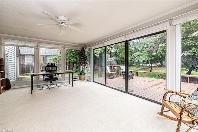 2014 Medhurst Dr, Greensboro, NC 27410 - sunroom featuring a ceiling fan, a deck, carpet floors, and crown molding