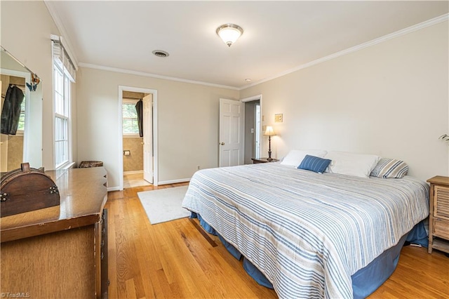 2014 Medhurst Dr, Greensboro, NC 27410 - bedroom featuring light wood finished floors, baseboards, ornamental molding, and ensuite bath