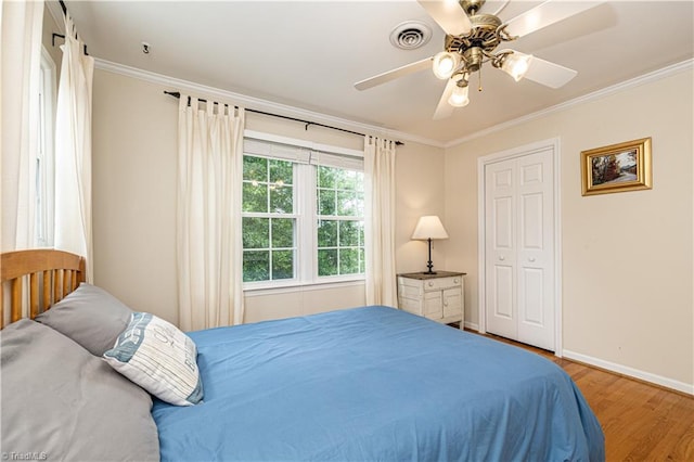 2014 Medhurst Dr, Greensboro, NC 27410 - bedroom featuring crown molding, wood finished floors, baseboards, and ceiling fan
