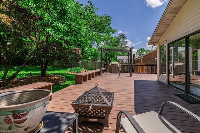 2014 Medhurst Dr, Greensboro, NC 27410 - wooden terrace with an outdoor fire pit and area for grilling