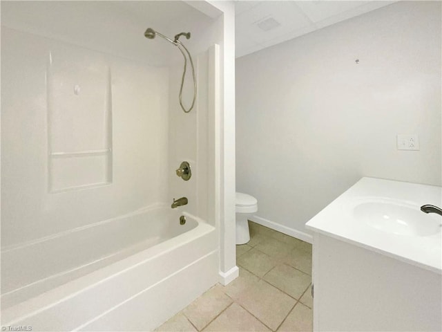 full bathroom with shower / bath combination, toilet, vanity, tile patterned flooring, and baseboards