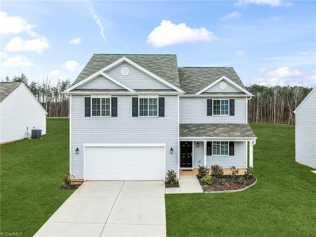 traditional-style house featuring a garage, a front lawn, central AC unit, and driveway