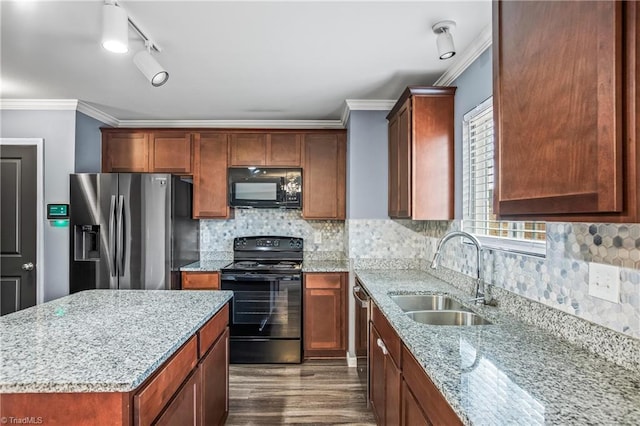 kitchen with crown molding, dark wood-type flooring, light stone countertops, black appliances, and a sink