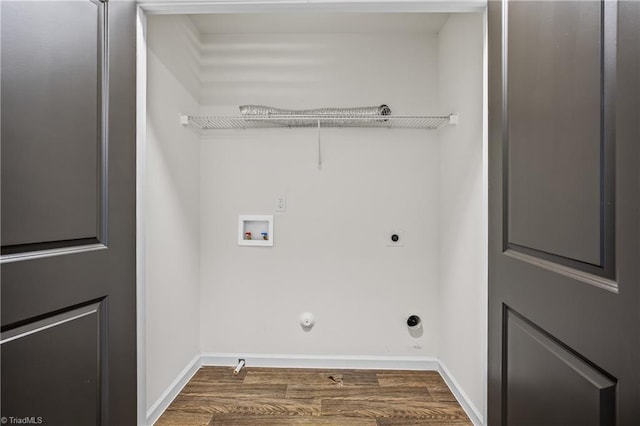 laundry area featuring baseboards, gas dryer hookup, washer hookup, electric dryer hookup, and dark wood-style flooring