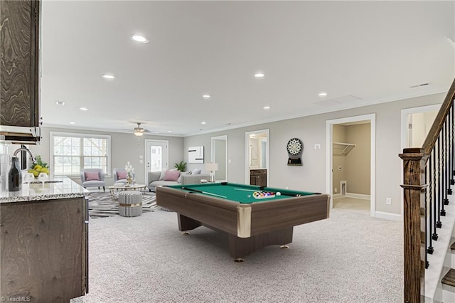 playroom with ceiling fan, pool table, ornamental molding, sink, and light colored carpet