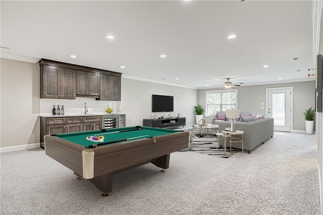 recreation room with crown molding, wet bar, light carpet, and billiards