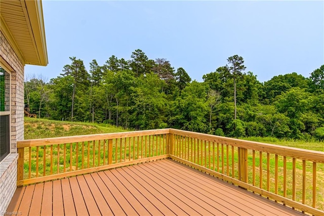 deck featuring a yard