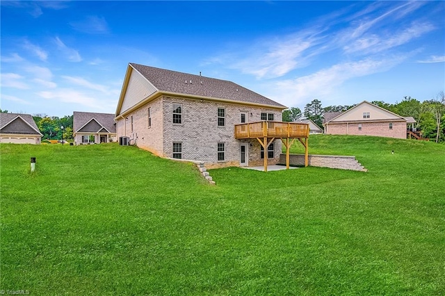 back of property featuring a lawn and a patio area