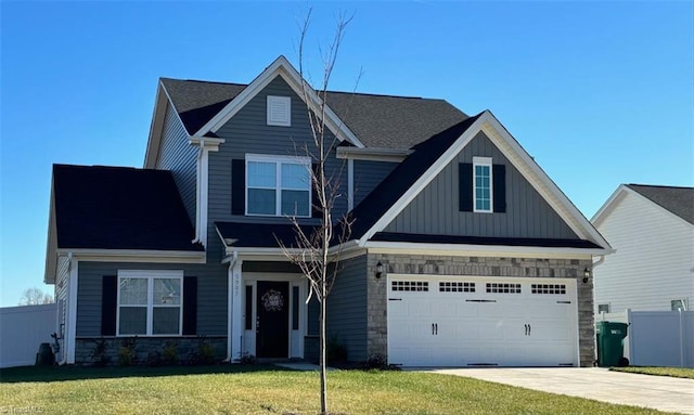 view of front of property featuring a front lawn, stone siding, a garage, board and batten siding, and driveway