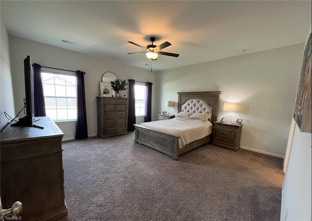carpeted bedroom featuring a ceiling fan, baseboards, and visible vents