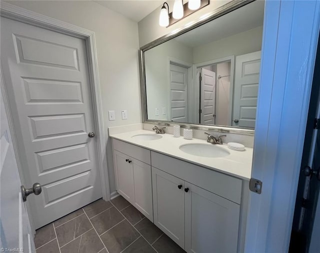 full bath with a sink and double vanity