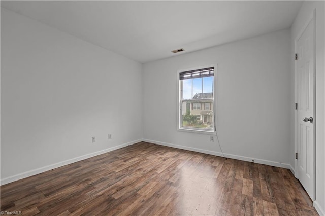 1310 Silver Dr, Mebane, NC 27302 - spare room featuring dark wood-style floors and baseboards